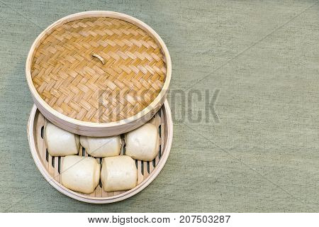 Chinese Steam buns in a bamboo basket