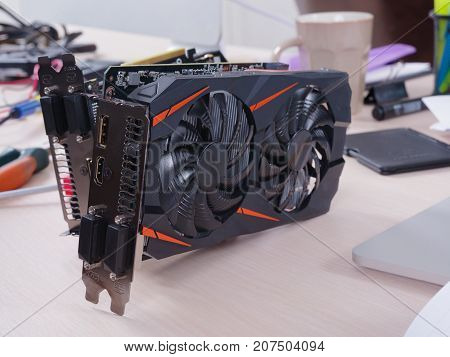 Close-up of a video card in the office on the desk.