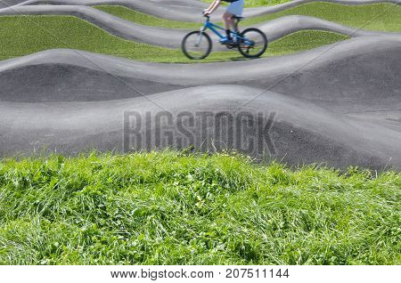 Man Riding Bicycles On Pump Track