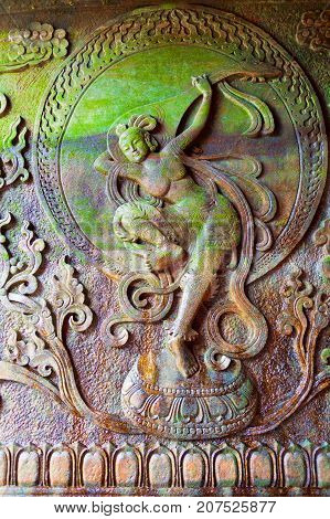 Leshan July 2011 - In July many visitors come to see this site of the world most impressive religious statue to enjoy also the garden and the temple of this UNESCO site. In the garden a bas relief represents a buddhist goddess playing a lute