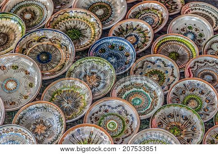 Romanian traditional ceramic in the plates form painted with specific patterns for Horezu area.