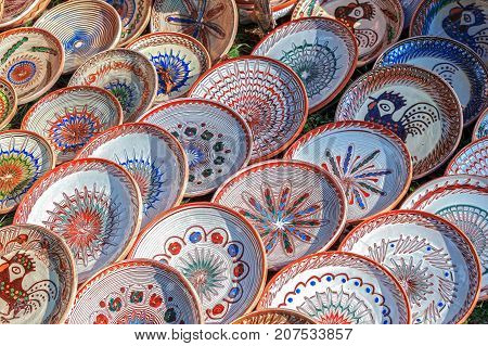 Romanian traditional ceramic in the plates form painted with specific patterns for Horezu area.