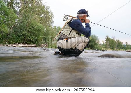 Fly-fisherman fishing in the Gallatin River, Montana