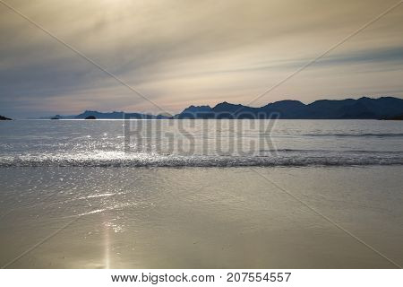 Sunset on the empty Roervik beach Lofoten island Norway