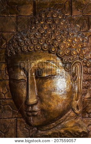 Siddhartha bronze statue. Close up of Buddha beautiful serene face with closed eyes. Best meditation inspiration image or mindfulness background.