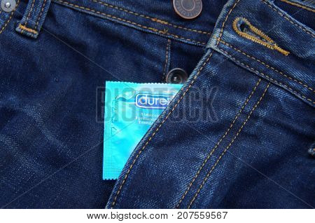 Almere, The Netherlands - October 6, 2017: Durex condom coming out of a jeans fly