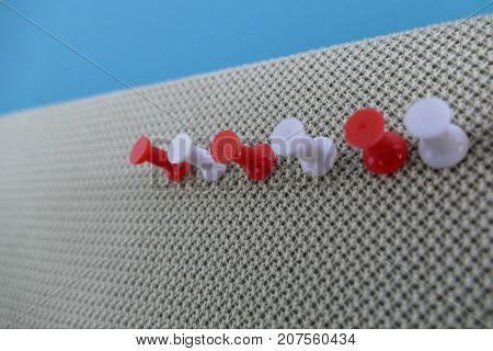 Colored Pin In An Office Pinboard