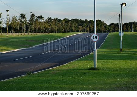 Fifteen mile per hour speed limit on new road to service holiday campsite.