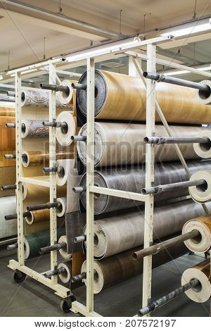 Rolls of linoleum with a different texture and pattern