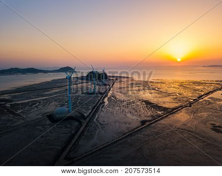 Aerial View Sunset Of Wind Turbine In Daebudo Island,south Korea
