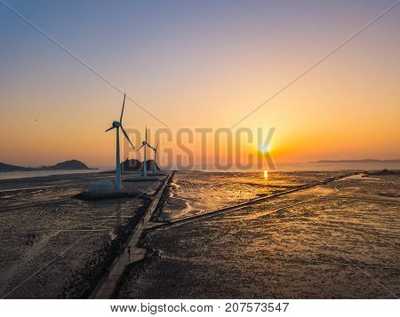 Aerial View Sunset Of Wind Turbine In Daebudo Island,south Korea