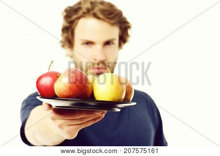 Face Expression Of Strong And Confident Man Offering Apples