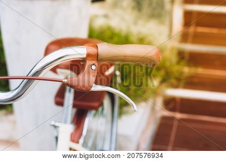 closeup handle/brake of a vintage bicycle .
