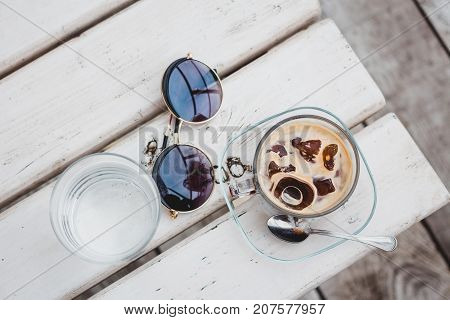 Close-up of the cup of ice coffee on the table