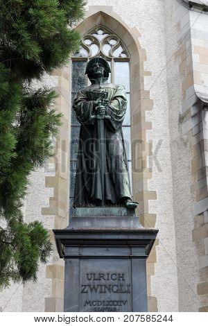 The Monument Of Urlich Zwingli In The Center Of Zurich.