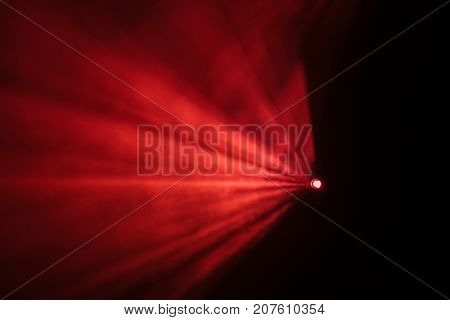 Rays theatrical spotlights on the stage during the performance. Lighting equipment. The lighting designer. Theatrical smoke. The art and creativity.