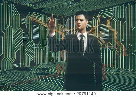 Handsome european businessman pointing at something in abstract circuit board room. Technology concept. Double exposure