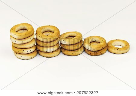 Dryings with poppy seeds on a white background are spread out with a ladder