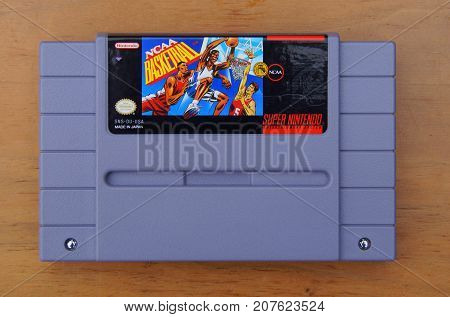 Almere, The Netherlands - September 29, 2017: Super Nintendo Entertainment System (SNES) game cartridge of NCAA Basketball.