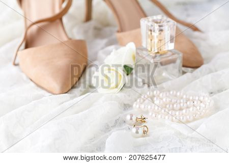 Glass Scent Bottle On Ladies Dressing Table With Shabby Schic Pearl Necklace And Laces
