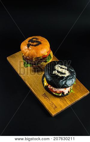 Two Crafting A Burger On The Board