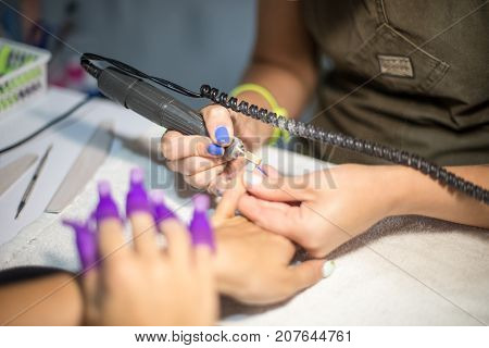 Hardware Manicure. Removal Of Old Gel Varnish In The Salon. Manicure Master Doing Beauty Procedure F