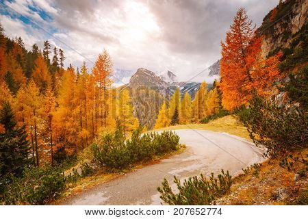Stunning image of the alpine road. Dramatic morning scene, gloomy weather. Location famous place National Park Tre Cime di Lavaredo, Misurina, Dolomiti alps, South Tyrol, Italy, Europe. Beauty world.