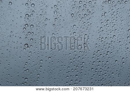 Water drop at the window glass transparent On the day of inclement weather and heavy rain