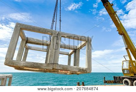 The Crane On  Barge Droping The Artificial Reef.