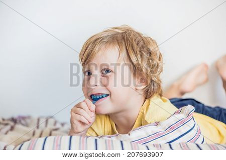 Three-year Old Boy Shows Myofunctional Trainer To Illuminate Mouth Breathing Habit. Helps Equalize T