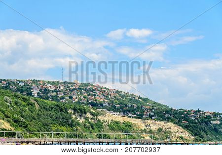 The Black Sea Shore, Green Hills With Houses, Blue Clouds Sky. City Balchik Coast