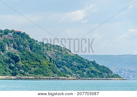 The Black Sea Shore, Green Hills With Houses, Blue Clouds Sky. City Balchik Coast