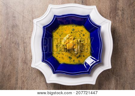 Pequi Fruit With Chicken Over A Wooden Table. Frango Com Pequi.