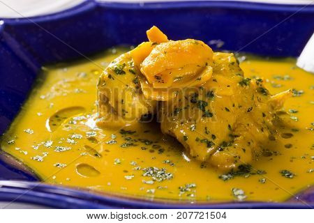 Pequi Fruit With Chicken Over A Wooden Table. Frango Com Pequi.