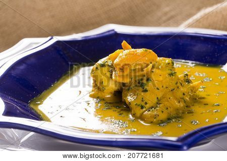 Pequi Fruit With Chicken Over A Wooden Table. Frango Com Pequi.