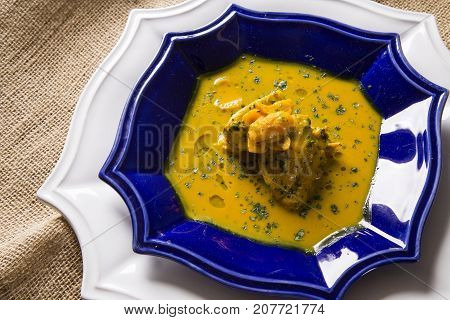 Pequi Fruit With Chicken Over A Wooden Table. Frango Com Pequi.