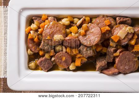South American Cuisine: Puchero Soup With Sausage. Close-up In A Pot On The Table.