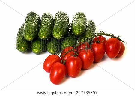 vegetables cucumbers and tomatoes on a white background