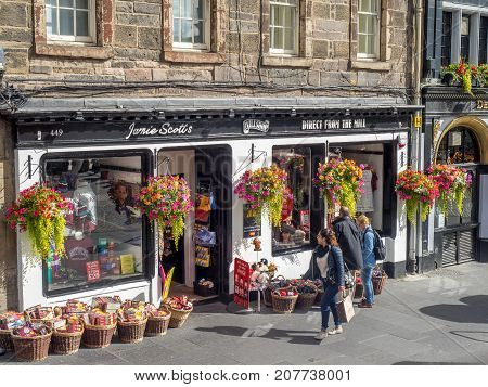 EDINBURGH, SCOTLAND - JULY 29: Tourist shops along the Royal Mile on July 29, 2017 in Edinburgh, Scotland. There are many such shops on the Royal Mile serving tourists with kilts, shirts, etc.