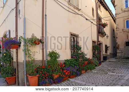 Nice facades in steep alley. The mountain village - about 1400 m above sea - Pescocostanzo in the region of Abruzzo Italy