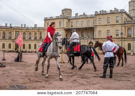 Gatchina St. Petersburg Russia - September 30 2017: Horse show of Cossacks on the parade ground of the Gatchina Palace. Cossacks artists are preparing for the tricks.