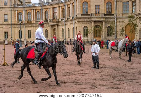 Gatchina St. Petersburg Russia - September 30 2017: Horse show of Cossacks on the parade ground of the Gatchina Palace. Cossacks artists are preparing for the tricks.