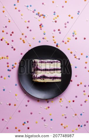 pieces of birthday cake on a pink background