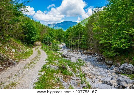 In The Mountains Lies A Winding Rocky Road.