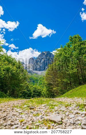 In The Mountains Lies A Winding Rocky Road.