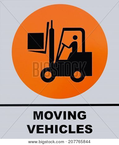 Photo of Moving Vehicle sign isolated on white background. This photo was taken from the sign board.