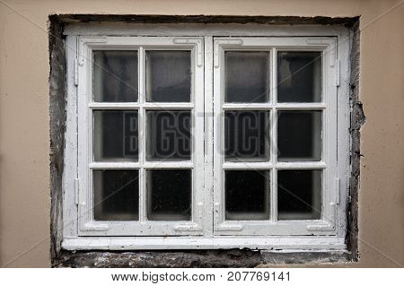 Window on a wooden white house in Iceland