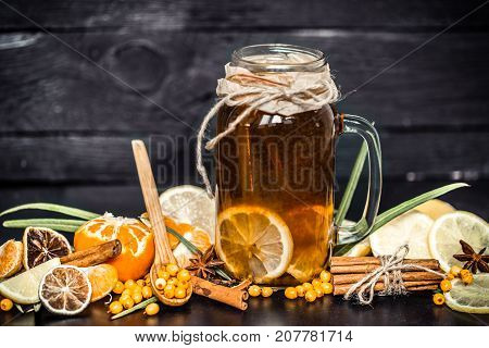 The Composition Of Tea With Lemon On A Black Background