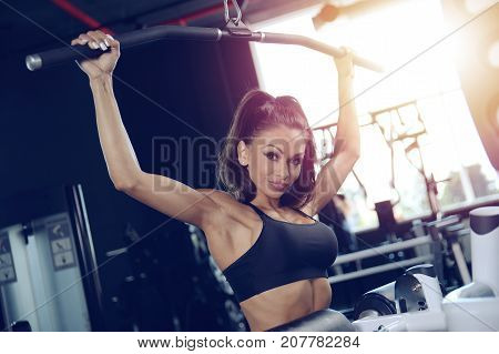 Sexy Athletic Young Girl Training Back In Gym