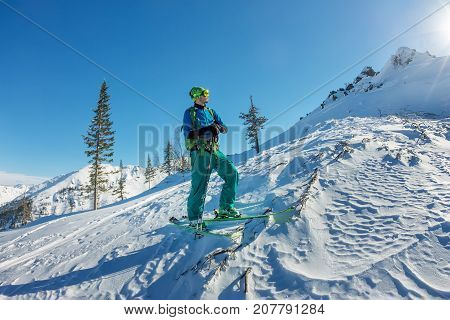 Man Skier Freerider Standing At Top Of Ridge, Adventure Winter Freeride Extreme Sport